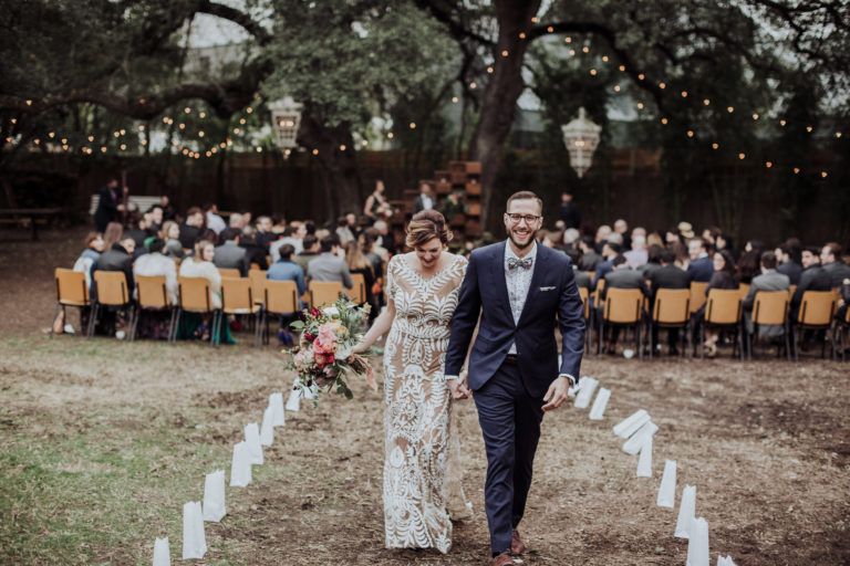 recently married couple walking down the aisle