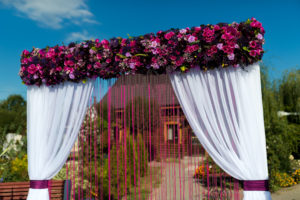 beautiful-wedding-arch-ceremony-garden-sunny-weather